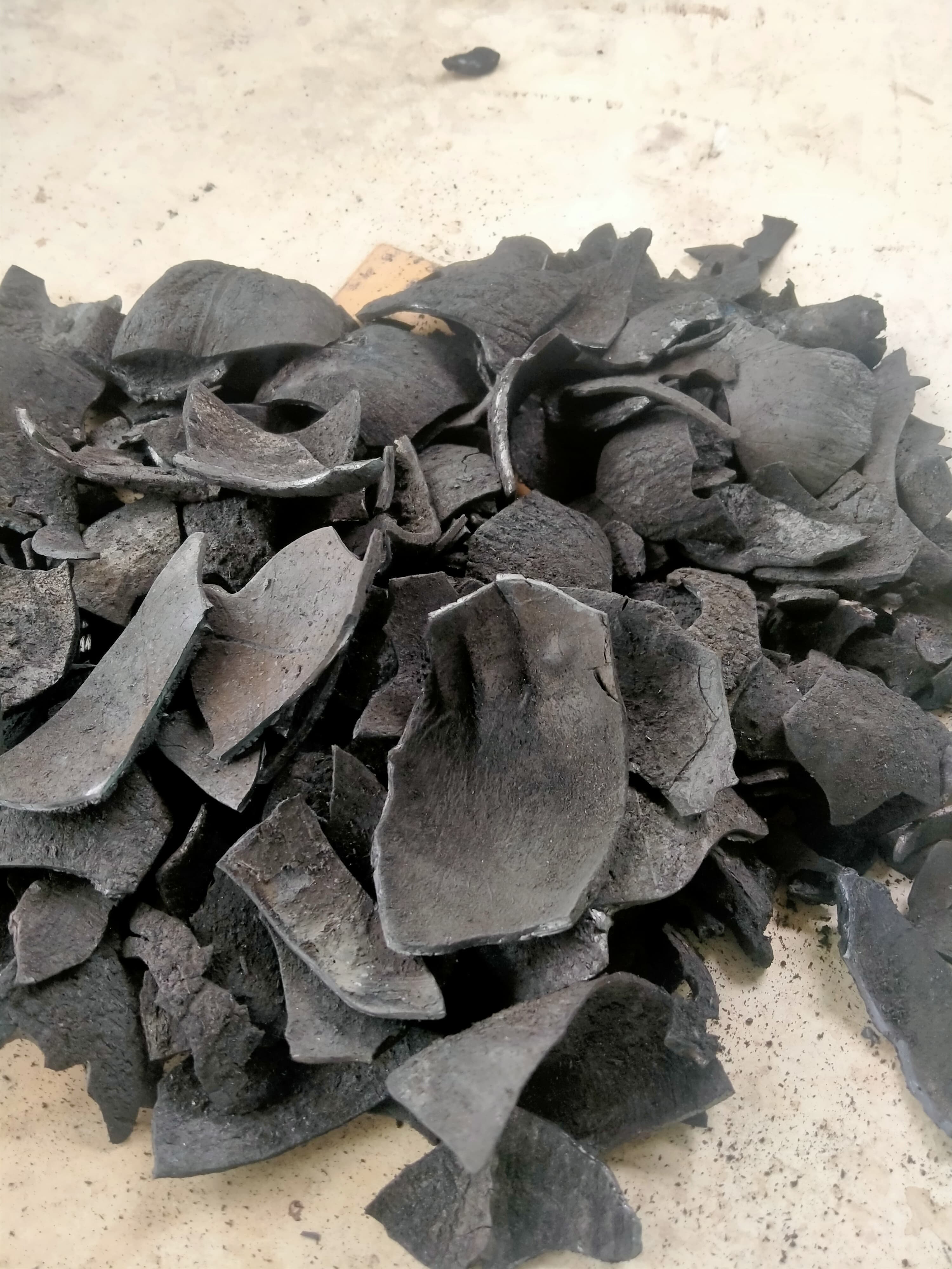 Natural pieces of coconut shell charcoal